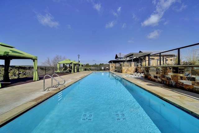 view of swimming pool with a patio