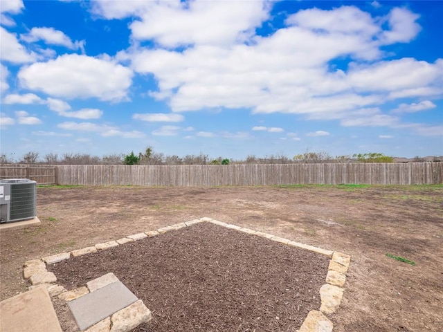 view of yard with central AC