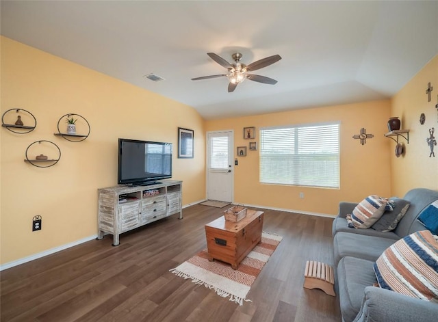 living room featuring ceiling fan, dark wood-type flooring, and vaulted ceiling