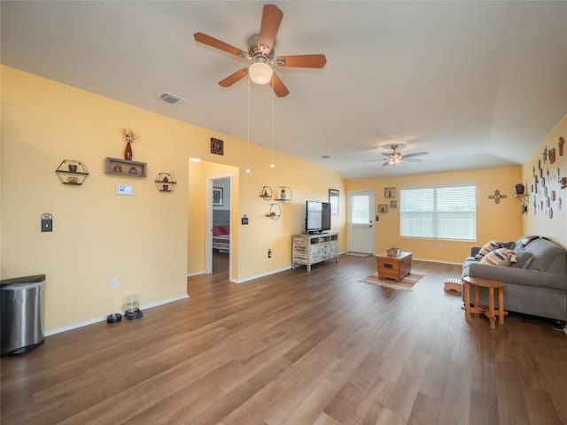 living room with ceiling fan and hardwood / wood-style floors