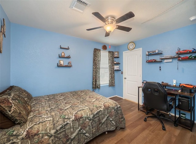 bedroom with ceiling fan and hardwood / wood-style floors