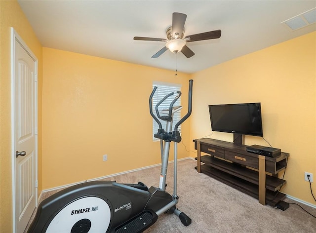 exercise room with carpet and ceiling fan