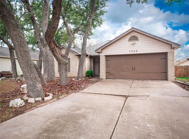 single story home featuring a garage