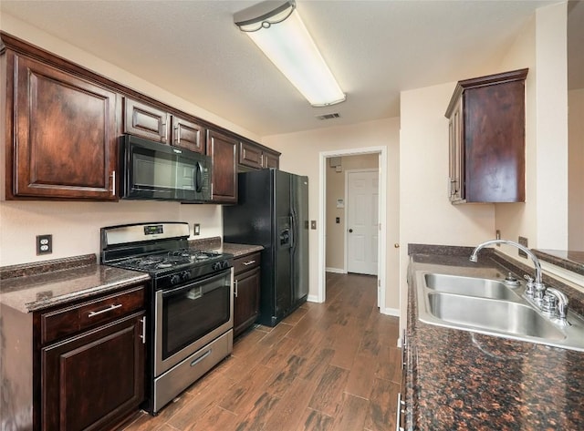 kitchen with dark hardwood / wood-style flooring, dark brown cabinetry, sink, and black appliances