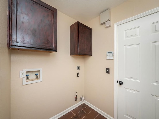 clothes washing area with electric dryer hookup, gas dryer hookup, hookup for a washing machine, and cabinets