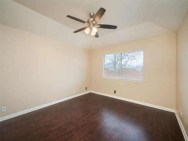 unfurnished room featuring ceiling fan and dark hardwood / wood-style floors