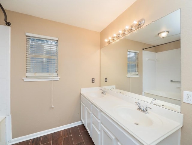 bathroom with plenty of natural light and vanity