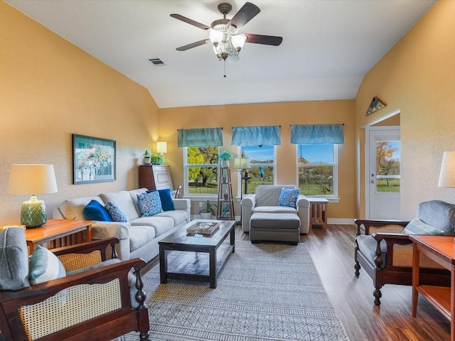 living room with ceiling fan, wood-type flooring, and lofted ceiling