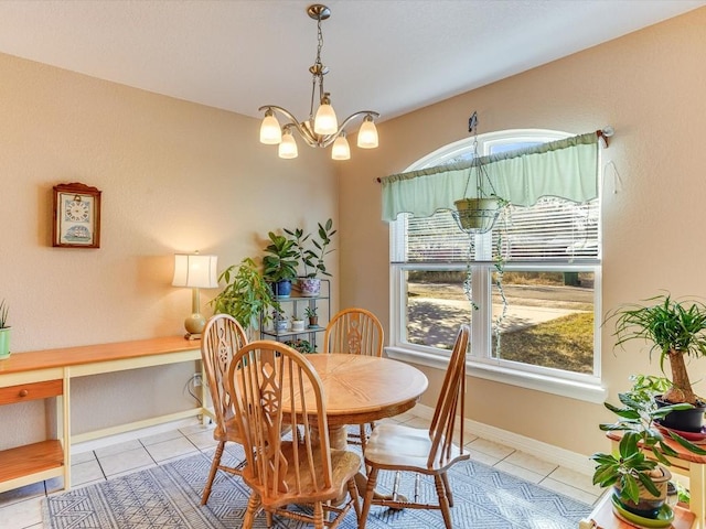 dining space with a notable chandelier and light tile patterned floors