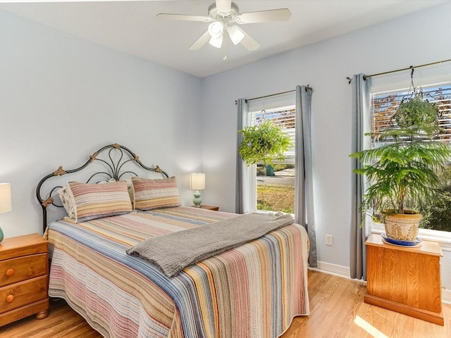 bedroom featuring ceiling fan and light wood-type flooring