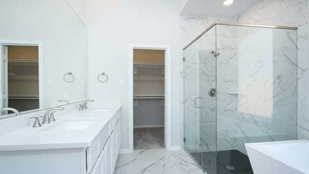 bathroom with vanity and separate shower and tub