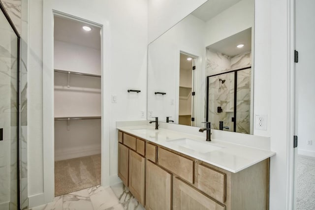 192 Bay Breeze Dr, Kyle, TX 78640 - full bathroom featuring a marble finish shower, marble finish floors, a walk in closet, double vanity, and recessed lighting