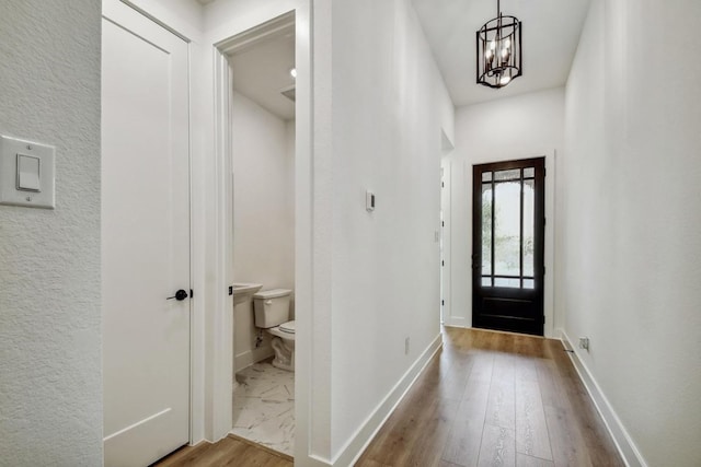 192 Bay Breeze Dr, Kyle, TX 78640 - entryway featuring a chandelier, baseboards, and marble finish flooring