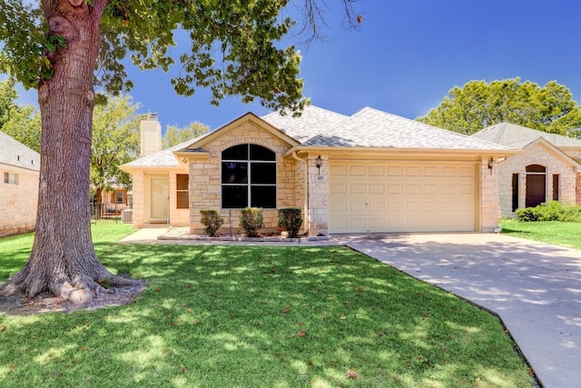 single story home with a garage and a front lawn