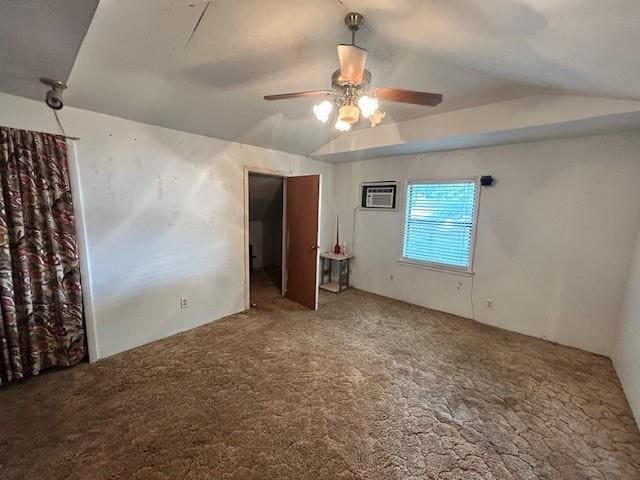 unfurnished bedroom featuring carpet flooring, a wall mounted AC, ceiling fan, and lofted ceiling