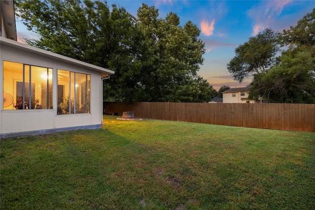 view of yard at dusk