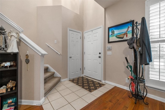 tiled entryway featuring a wealth of natural light