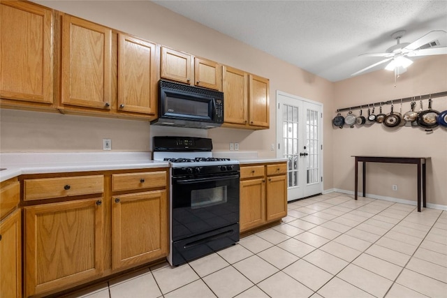 kitchen featuring black appliances, ceiling fan, light tile patterned floors, and french doors