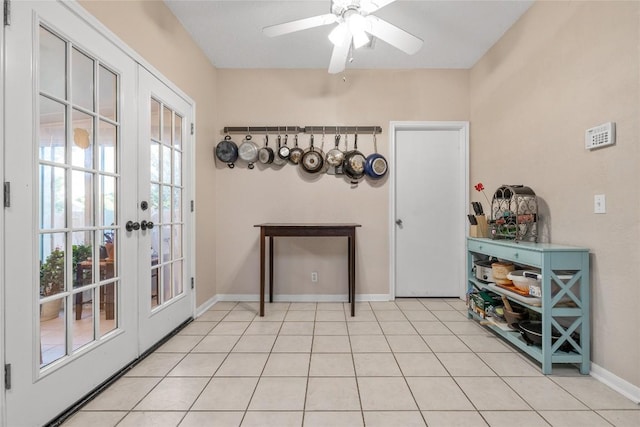 doorway with french doors, light tile patterned floors, and ceiling fan