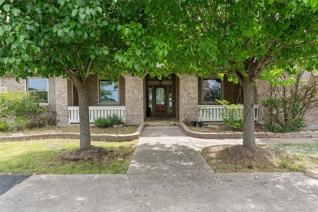 doorway to property with a porch