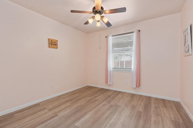 empty room featuring light wood-type flooring and ceiling fan