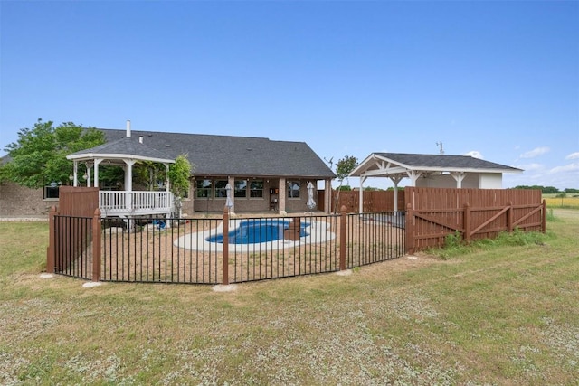 view of swimming pool with a gazebo and a lawn