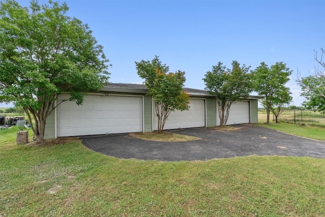 garage with a yard