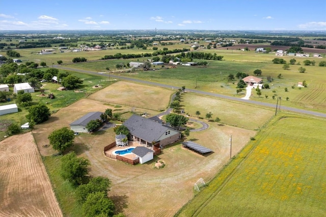 birds eye view of property with a rural view