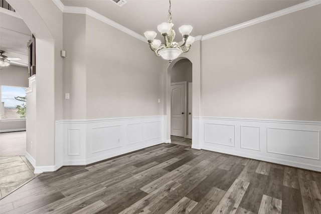 unfurnished dining area featuring dark hardwood / wood-style flooring, ceiling fan with notable chandelier, and ornamental molding