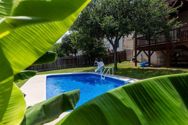 view of swimming pool with a wooden deck