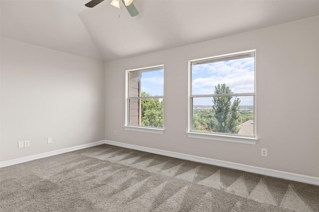 unfurnished room featuring carpet, vaulted ceiling, and ceiling fan