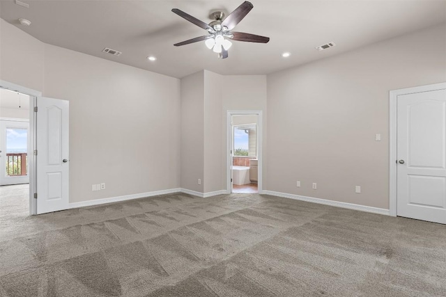 carpeted spare room with ceiling fan and a healthy amount of sunlight