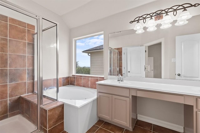 bathroom with vanity, vaulted ceiling, tile patterned floors, and independent shower and bath