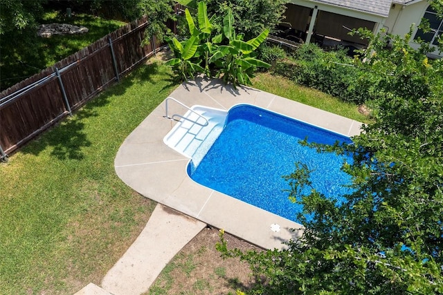 view of pool with a yard and a patio area