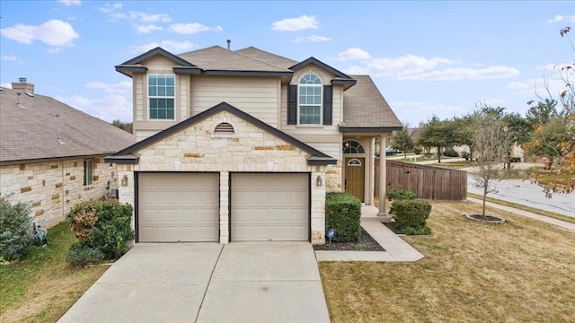 front facade featuring a garage and a front yard