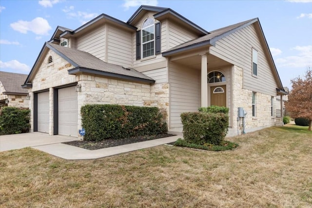 view of front of home featuring a front lawn and a garage