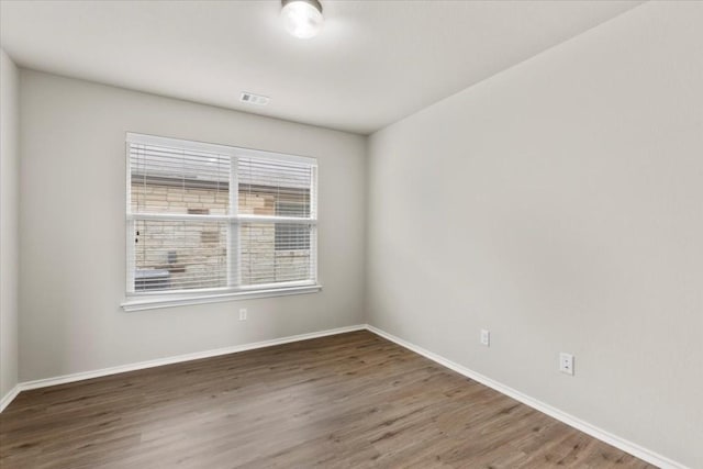 empty room featuring dark hardwood / wood-style floors