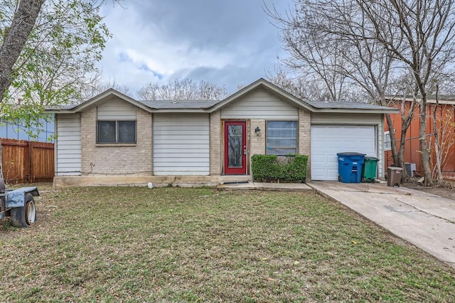 ranch-style house featuring a front lawn and a garage