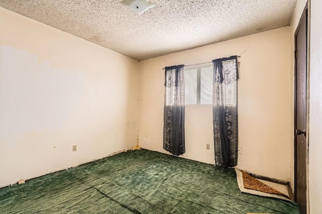 spare room featuring a textured ceiling