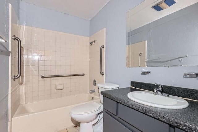 full bathroom with tile patterned flooring, toilet, vanity, and tiled shower / bath