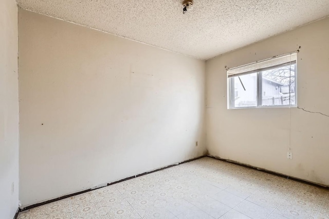 empty room with a textured ceiling