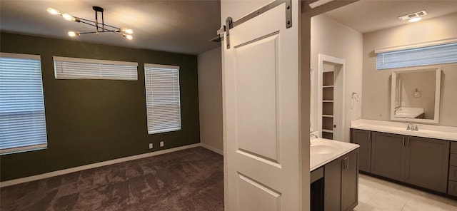 bathroom featuring vanity and an inviting chandelier