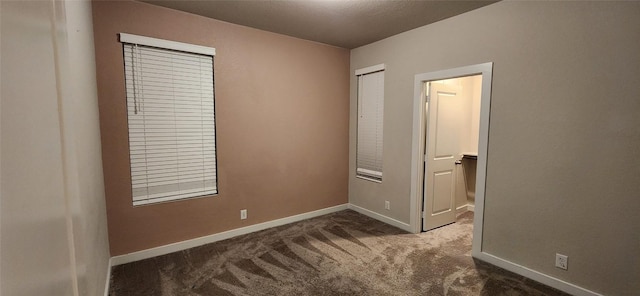 bedroom with dark carpet and a closet