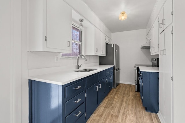 kitchen featuring white cabinetry, sink, stainless steel appliances, blue cabinets, and light wood-type flooring