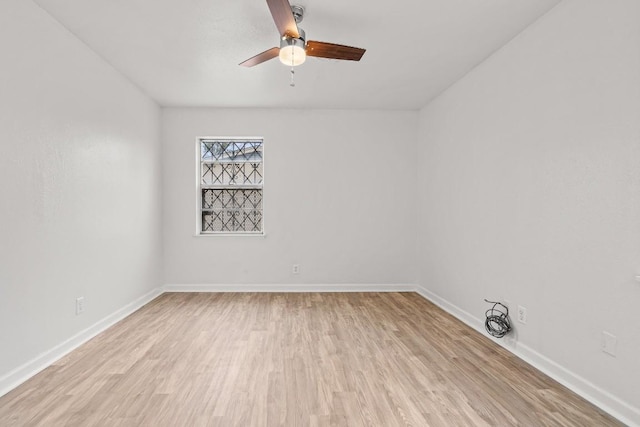 unfurnished room with ceiling fan and light hardwood / wood-style floors