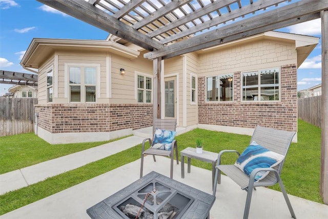 view of patio / terrace with a pergola and a fire pit