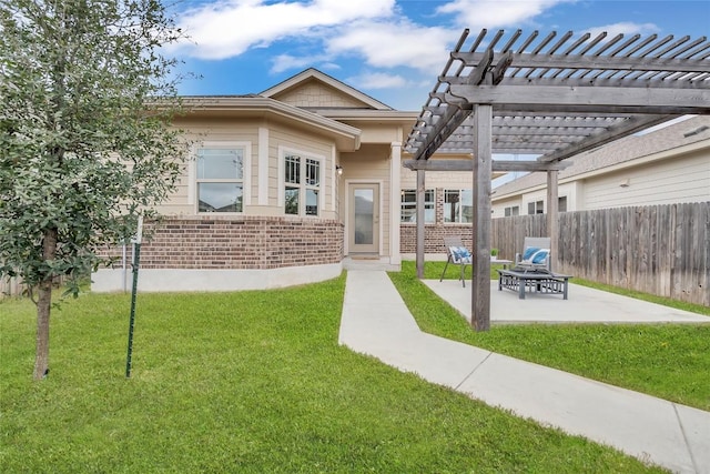 exterior space with a pergola, a patio area, and a lawn