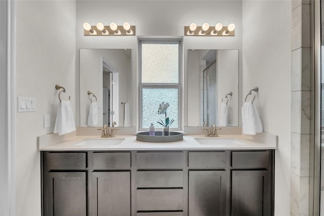 bathroom with vanity and a shower with shower door