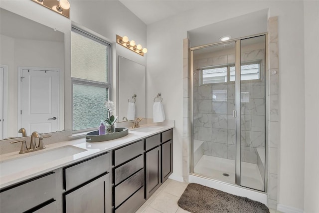 bathroom with vanity, tile patterned floors, and a shower with shower door