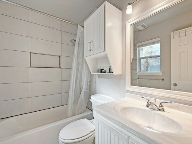 full bathroom featuring vanity, shower / bath combination with curtain, and toilet